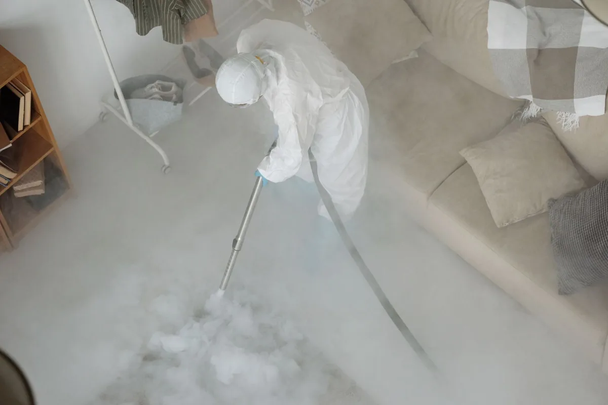 Biohazard cleanup technician in protective equipment, Highland City, FL